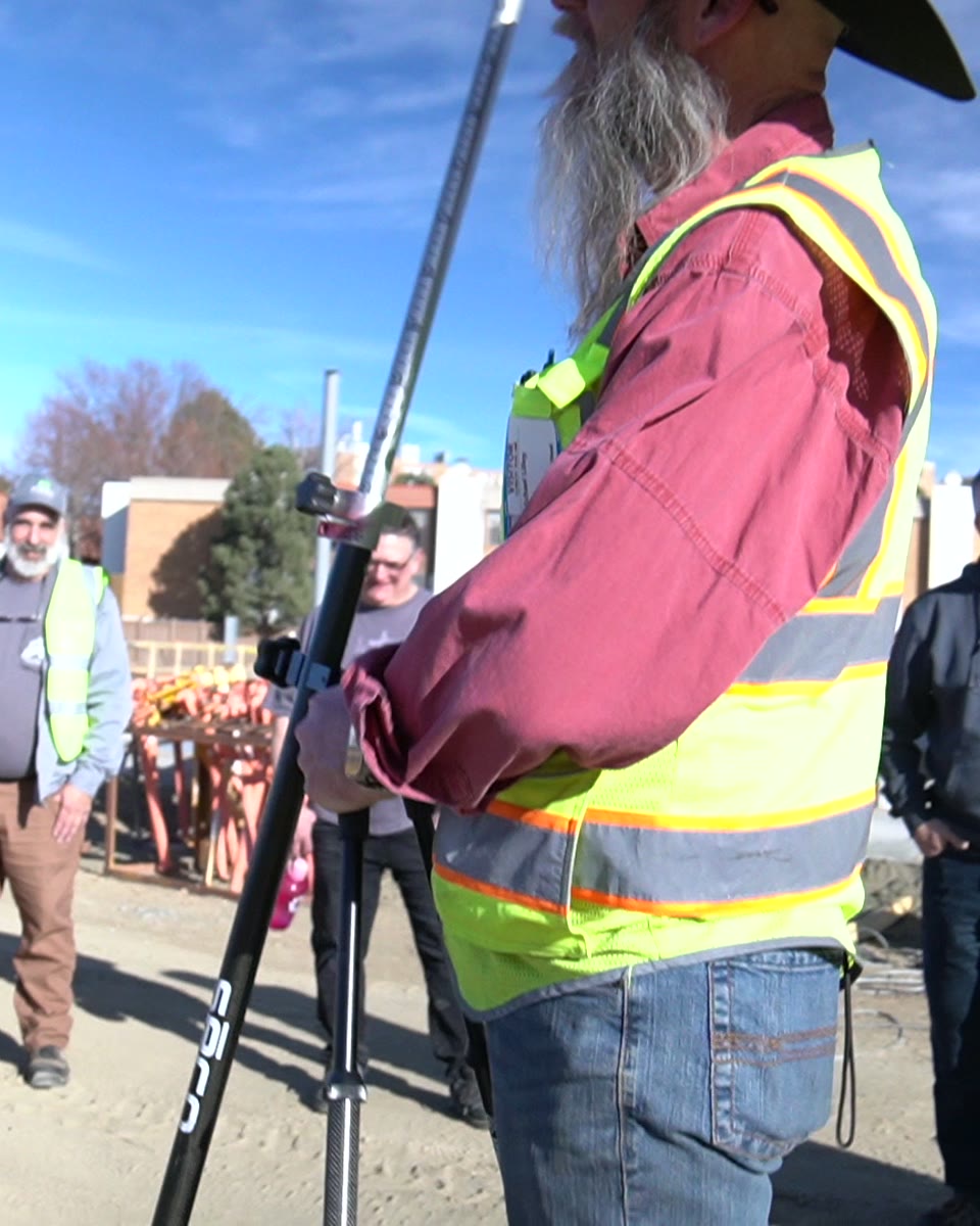 Instructor teaching at a tripod
